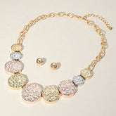 TEXTURED METAL PEBBLE DISC BEADED STATEMENT NECKLACE