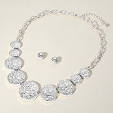 TEXTURED METAL PEBBLE DISC BEADED STATEMENT NECKLACE